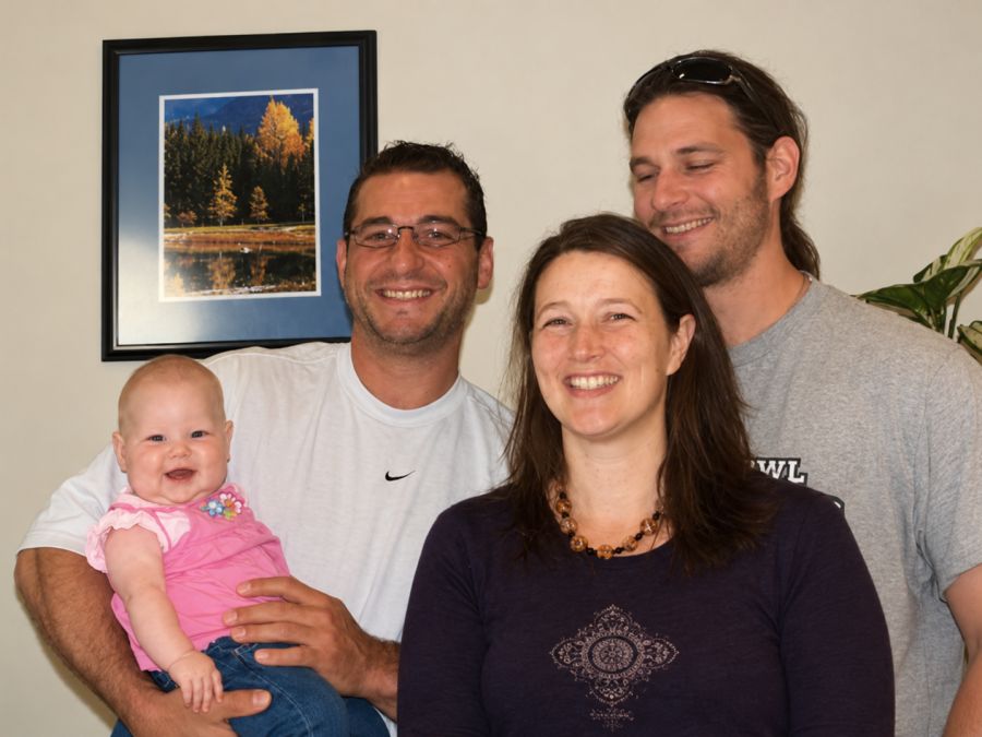 Baby Ava Gallie with her mom and dad and Dr. Marc Ferrin