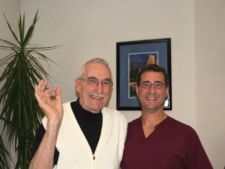 Lester Moe giving the A-OK sign beside Dr. Marc Ferrin